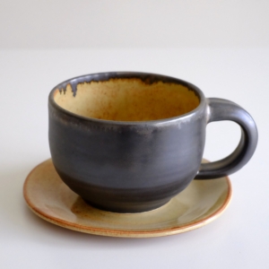 Abby Mouw: 92 Iron and Sand Cup and Saucer